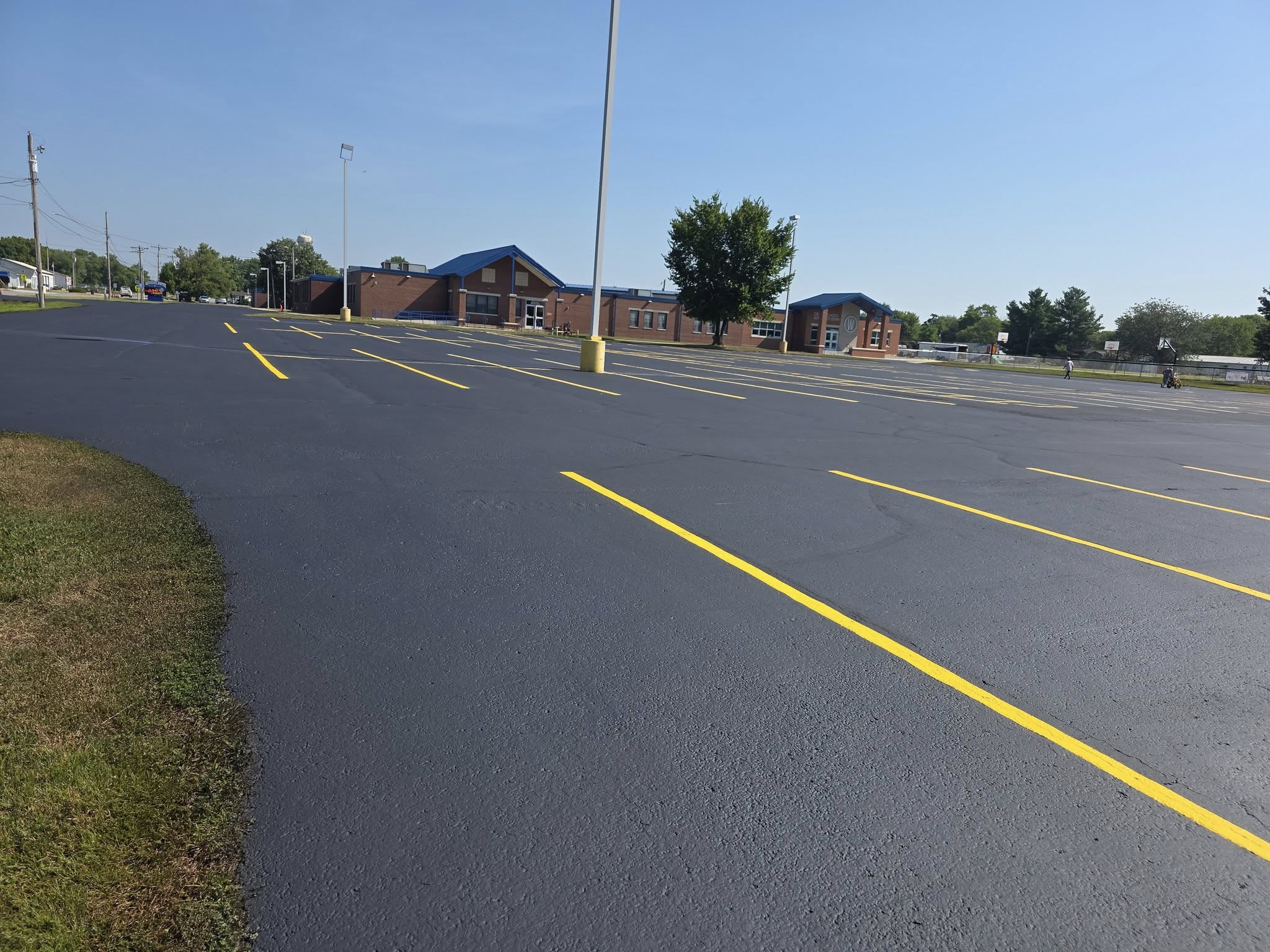 Angled view of freshly striped parking lines and handicap stalls