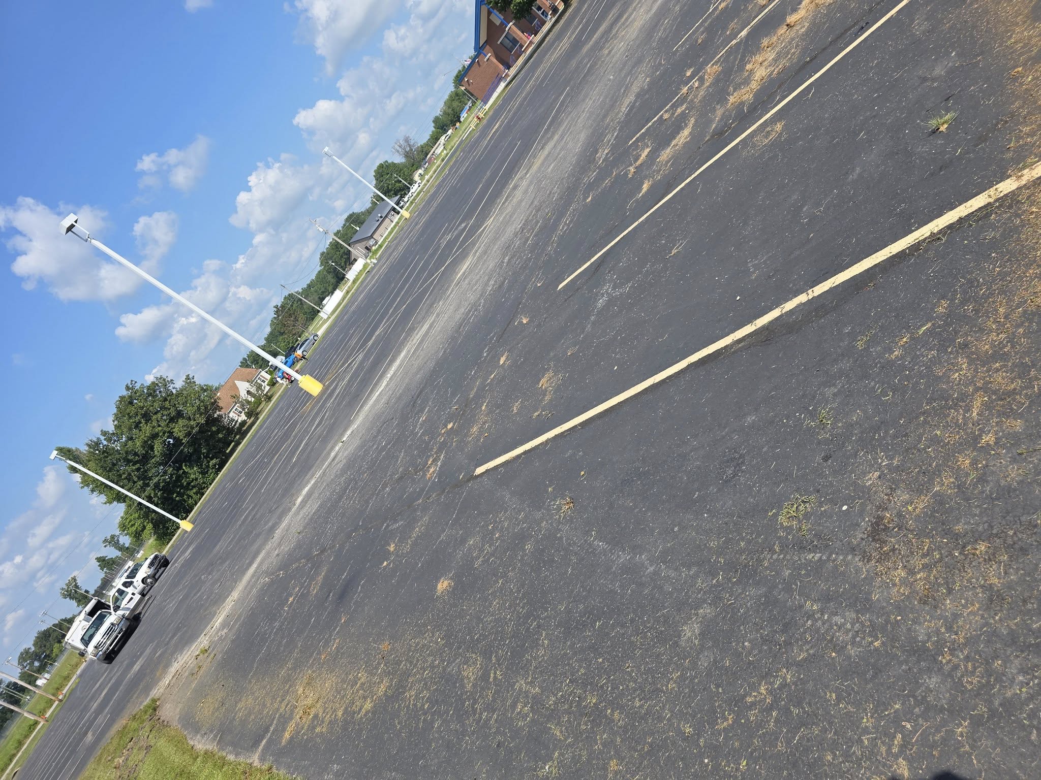 Completed parking lot sealcoating and restriping project